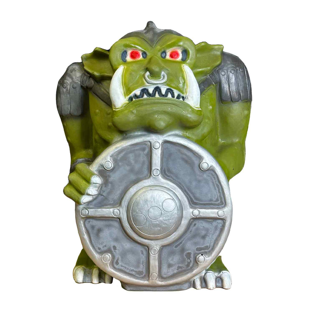 A full-scale archery target depicting a mischievous-looking goblin with a hand-painted finish, holding a shield and wearing armor.