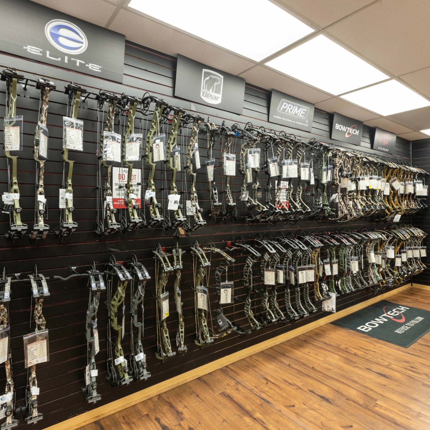 Fully stocked compound bow wall at Lancaster Archery Supply Pro Shop