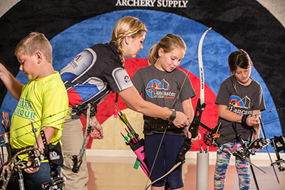 Academy instructors rewarded by teaching archery to others