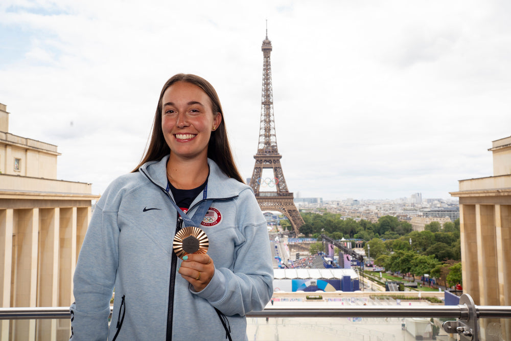 Casey Kaufhold with her Olympic bronze medal in front of the Eifel Tower. 