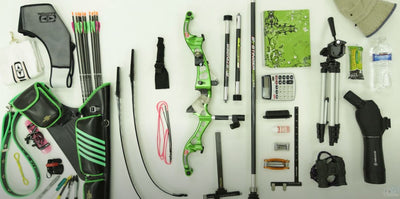 Components of a green recurve bow set-up and quiver with arrows set out on a table.