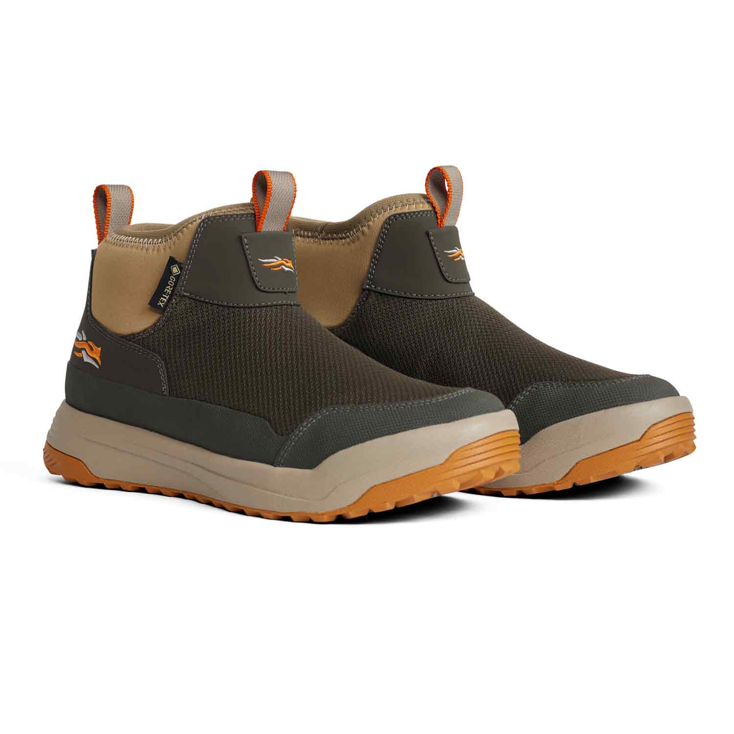 Pair of brown and beige slip-on shoes with orange accents on a white background