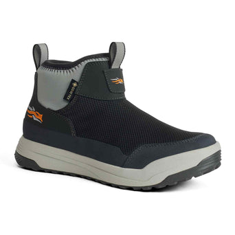 Black and gray shoe with orange logo on a white background