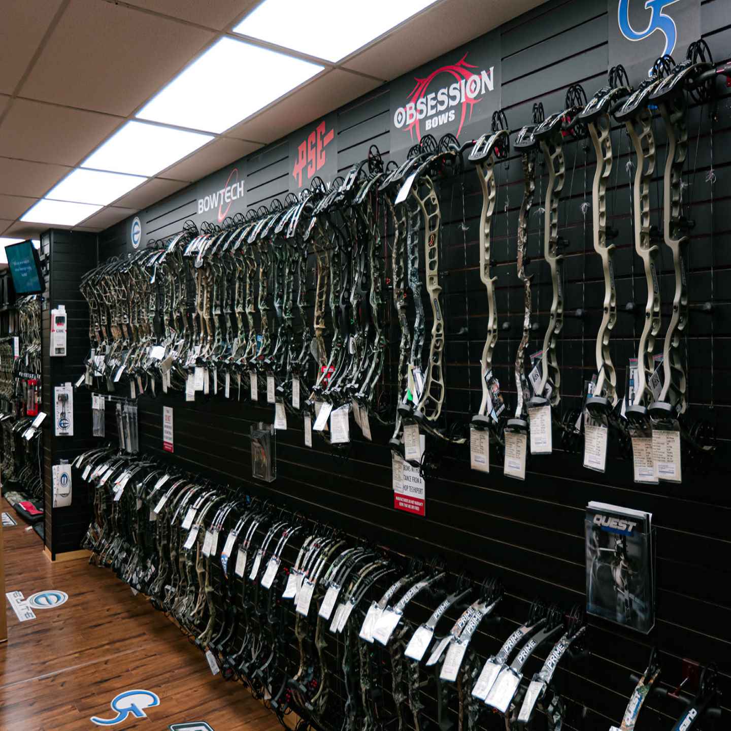 Fully stocked compound bow wall at Lancaster Archery Supply Pro Shop