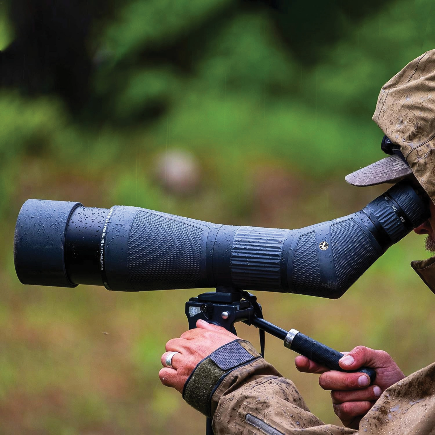 Hunter looks through Leupold spotting scope.