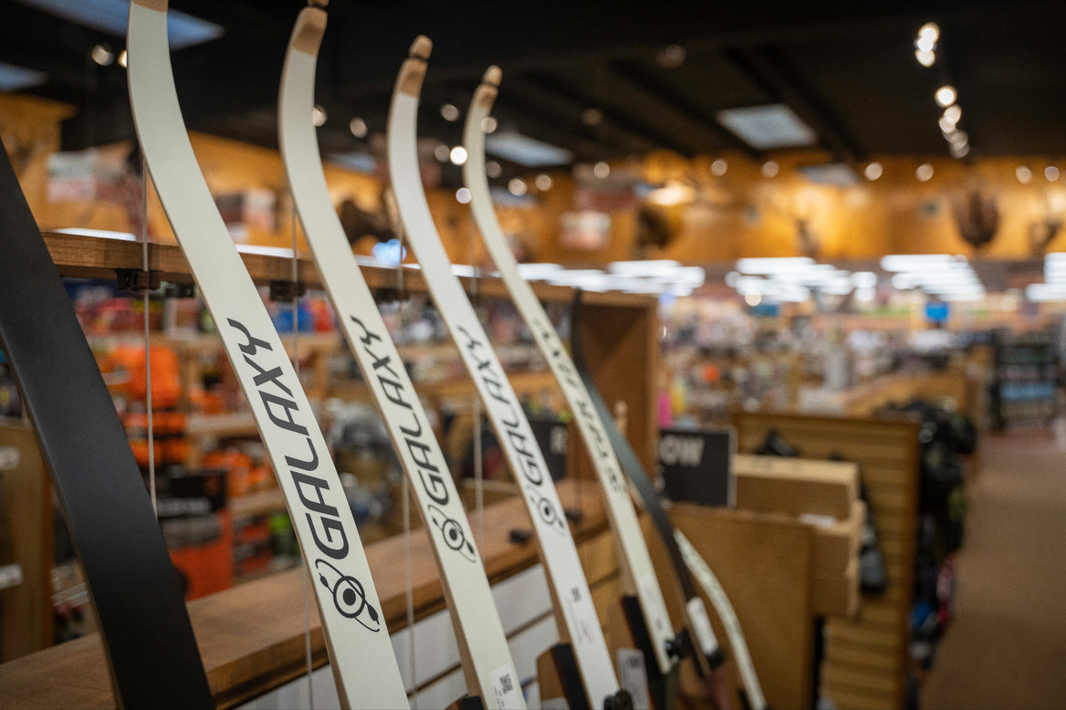 YETI Mug with compound archer in the background.