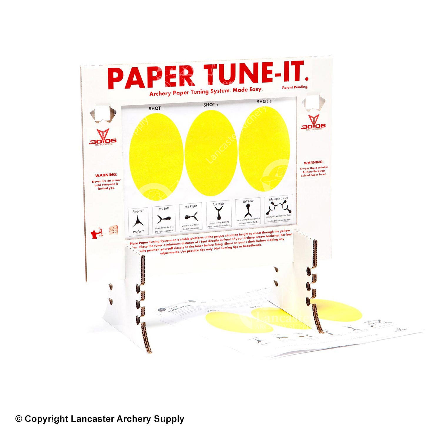A cardboard paper tuner that has two stands and holder for the tuning paper. The tuning paper has three yellow ovals for shot tuning.