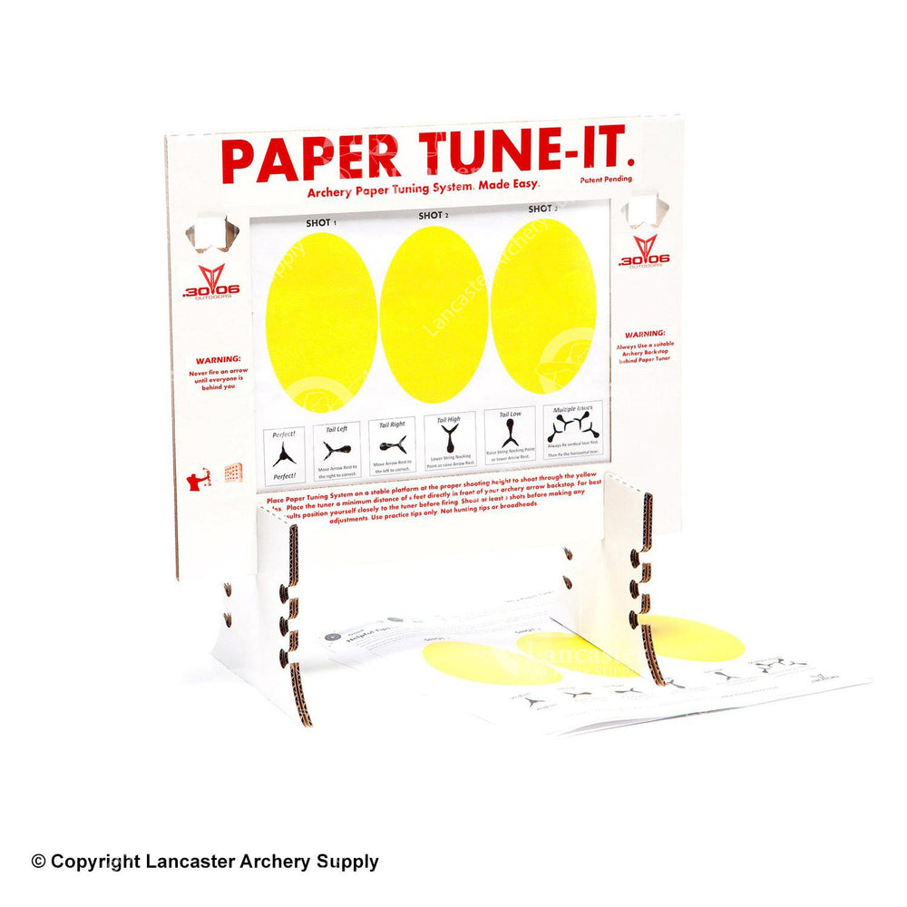 A cardboard paper tuner that has two stands and holder for the tuning paper. The tuning paper has three yellow ovals for shot tuning.
