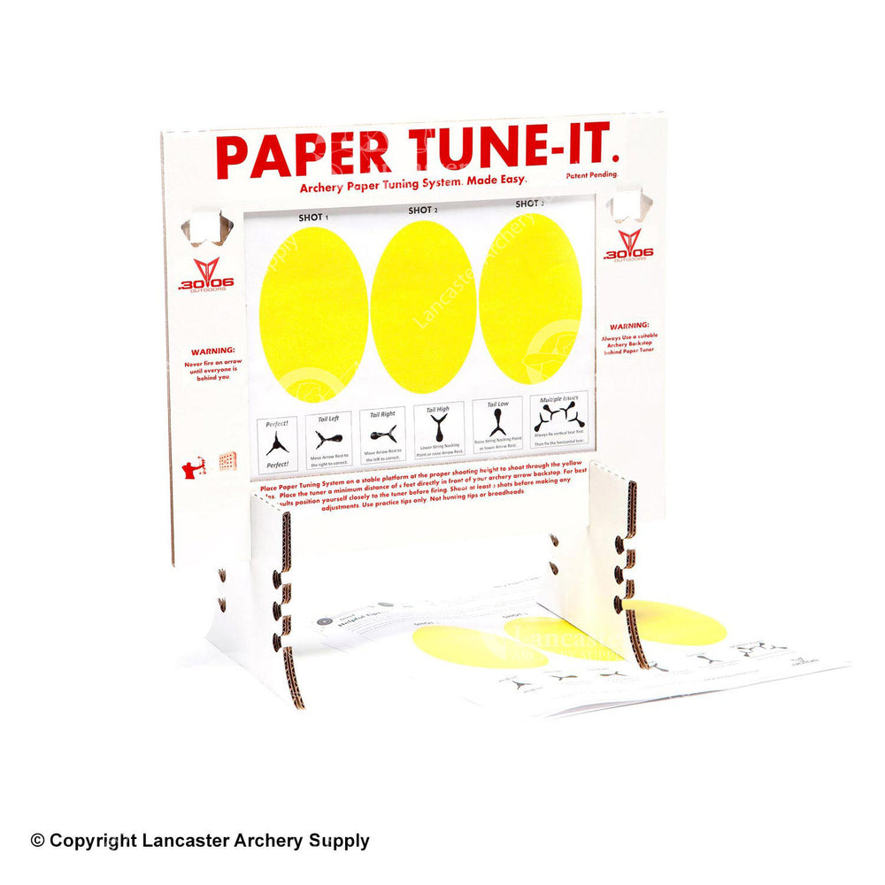 A cardboard paper tuner that has two stands and holder for the tuning paper. The tuning paper has three yellow ovals for shot tuning.