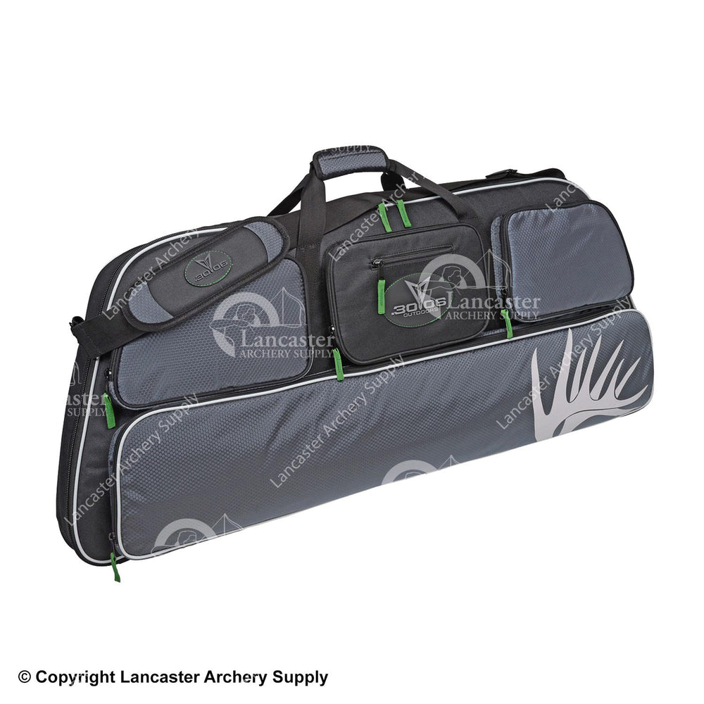 A gray and black bow case with green zippers and deer antlers on the bottom pocket.